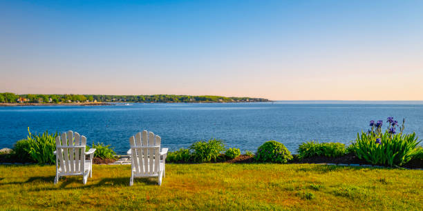 istock Two white wooden benches on the beach 1493754036
