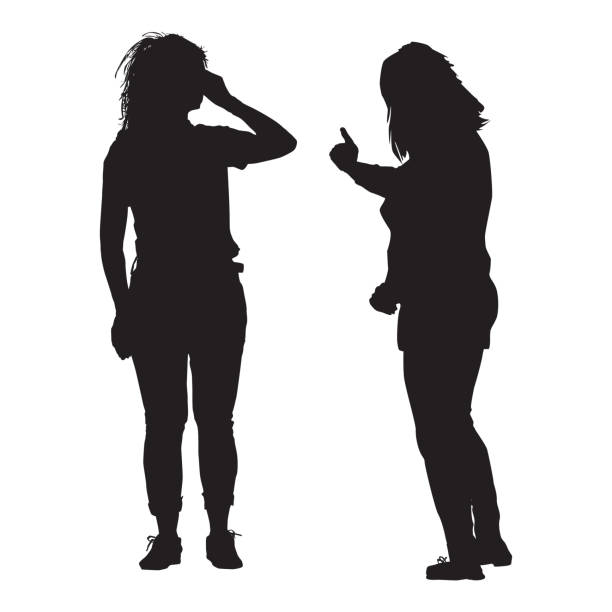 istock Two woman silhouette isolated on white background. Young women chatting with each other. 1493757037