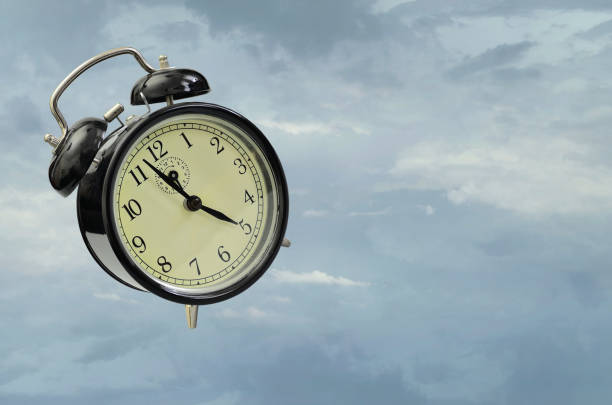 istock Alarm clock, floating in the air 1493759488