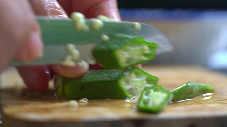 Close up shot of cut okra, Organic Homemade stir fly green okra with eggs and pickled garlic. Healthy food for diet.