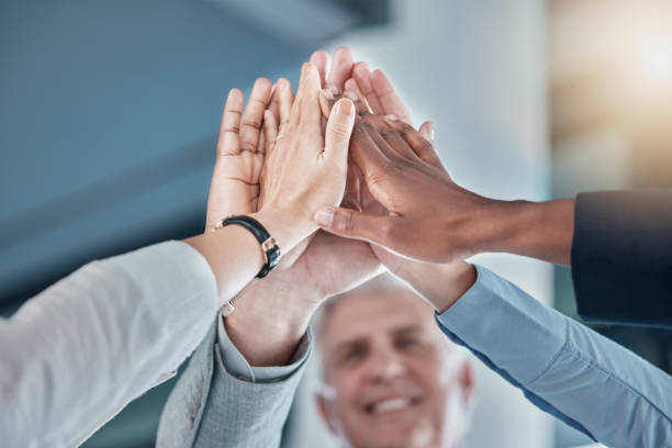 istock Business people, hands and high five in unity, partnership or collaboration for teamwork, agreement or trust at office. Group of employee workers touching hand together for team support or success 1493763580