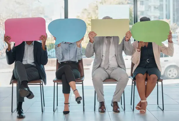 Photo of Feedback, mockup and speech bubble with business people in office for social media, job interview and vote. Logo, chat and opinion with group and sign in waiting room for voice, public and forum