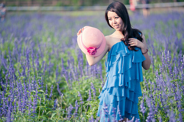A Chinese young women playing in the vast lavender