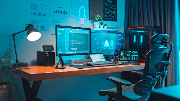 Desktop Computer of Programmer running AI machine learning software, AI innovation technology stock photo