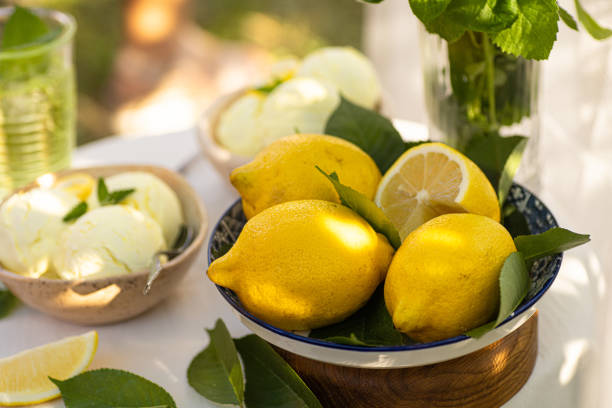 istock Vintage table setting with Linen napkins and yellow lemons. Decoration table. Close up. Cozy calm meal in the morning in the sunshine. 1493769875