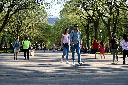 New York, USA, April 13, 2023 - Tourists and locals stroll along the Mall and Literary Walk in Central Park, midtown Manhattan, New York.