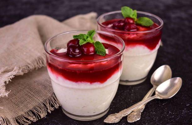 istock Delicate rice pudding with sweet and sour cherry jam on a black background. 1493784111