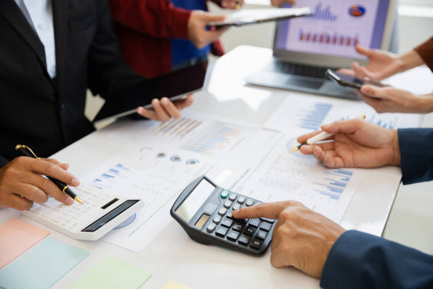 istock teamwork Business people are having a meeting to analyze data for business strategy planning. business idea 1493785454