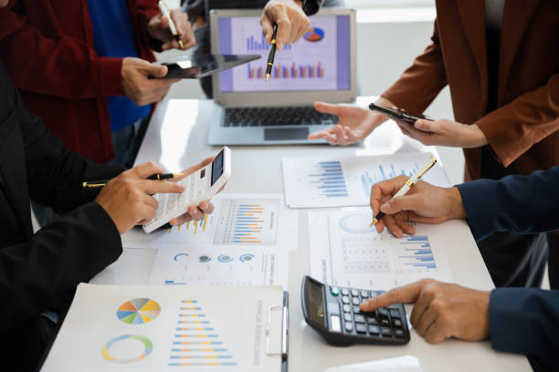 istock teamwork Business people are having a meeting to analyze data for business strategy planning. business idea 1493785478