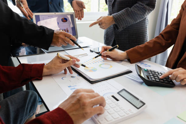 istock teamwork Business people are having a meeting to analyze data for business strategy planning. business idea 1493785597