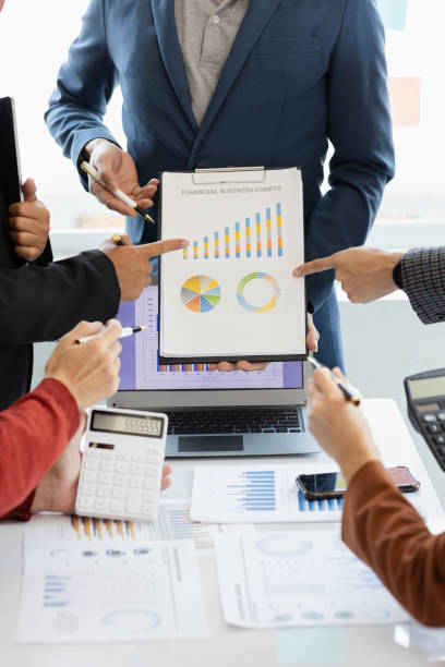 istock teamwork Business people are having a meeting to analyze data for business strategy planning. business idea 1493785604