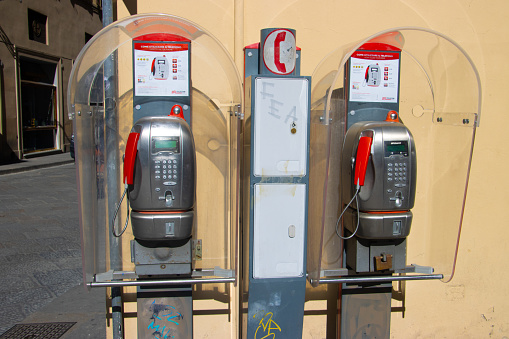 Obsolete pay phones in the center of Florence city, Italy