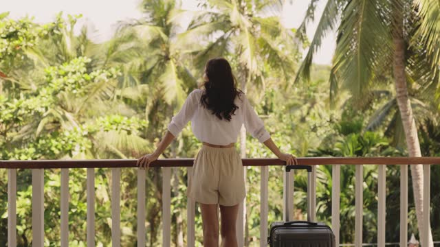 Young Tourist Woman Arrival with Luggage at Tropical Villa Hotel Room During Summer Vacation