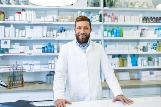 istock Pharmacist in pharmacy or drugstore looking at camera 1493798189
