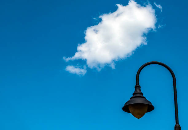Street light and one cloud in the sky