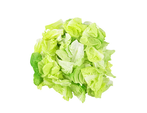 Chopped green lettuce isolated on white background. Top view
