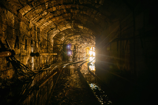 Old abandoned mine with rusty railroad.