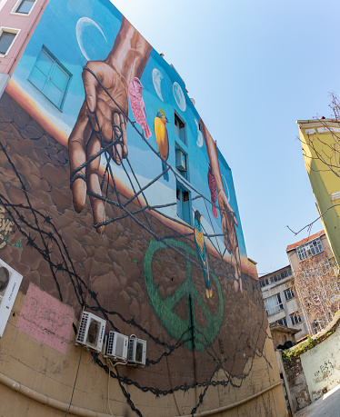 Izmir, Turkey - April 9, 2023: A picture of a colorful mural about peace and freedom in Izmir.