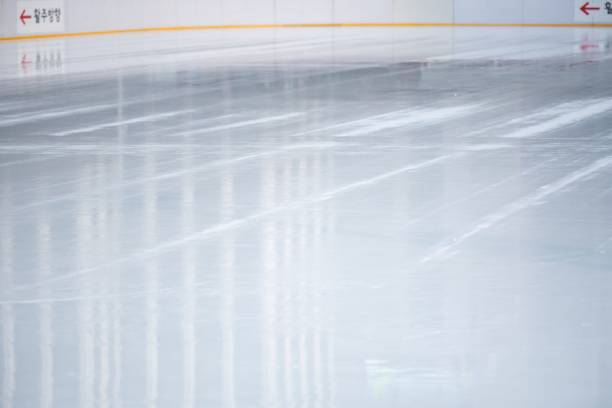 istock Smooth surface of an ice rink with freshly-watered floors. 1493812456