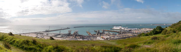 Dover, Great Britain - June 25, 2015: Harbor near Dover town on coast of England with ships with warehouses.