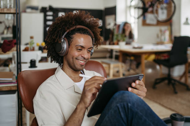 istock Young multiracial man drawing something in designers studio. 1493825677