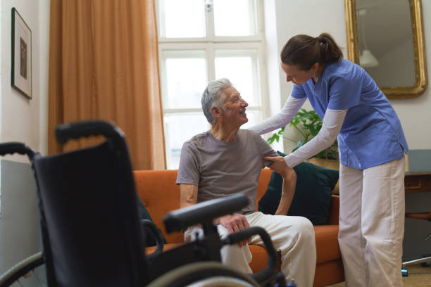 istock Young nurse checking elderly senior in his home. 1493827104