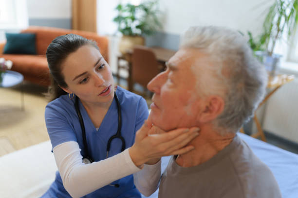 istock Young nurse checking elderly senior in his home. 1493827125