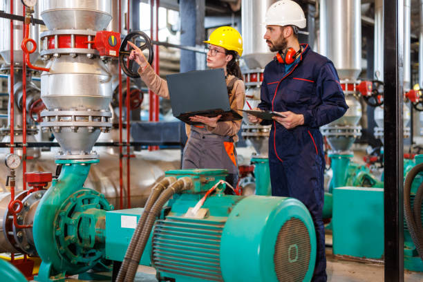 istock Young Engineers Working on a Laptop in the Plant's Control Room 1493828489