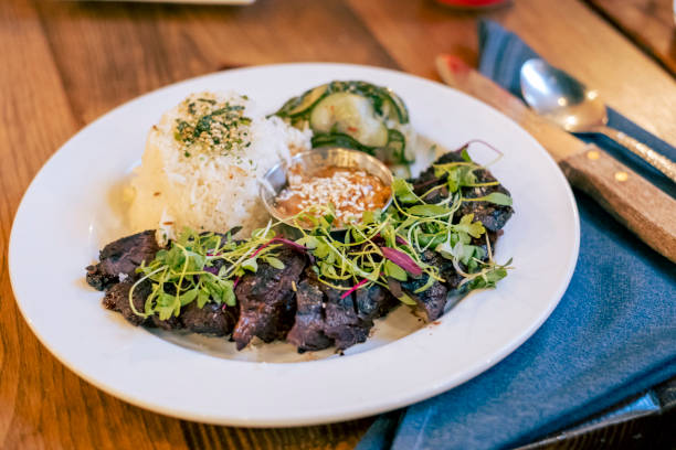 istock Steak with rice and vegetables prepared on a plate 1493833194