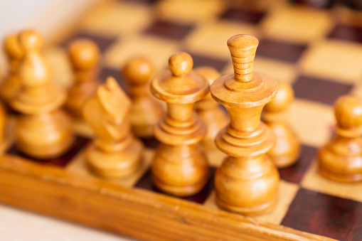 chess pieces on game board, detail photo, strategy game, horizontal position