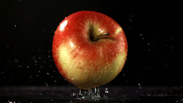 Apple fall on the table. Filmed is slow motion 1000 fps.