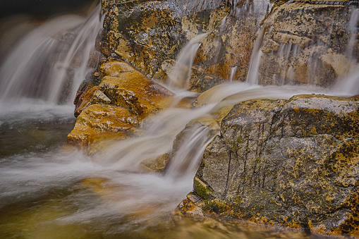 Water cascading down rocks on the hummingbird plume lookout hike, Alberta, Canada