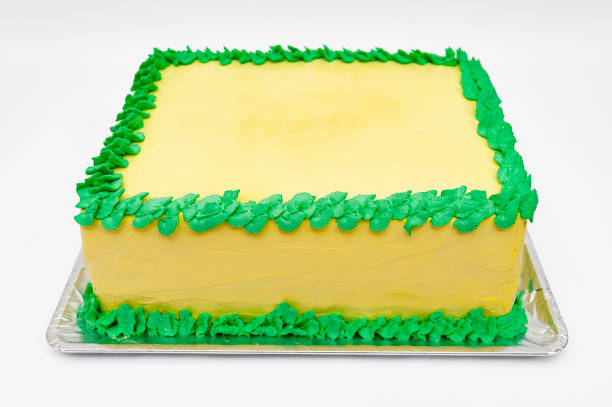 Birthday cake with green and yellow colors isolated on white background Birthday cake with green and yellow colors isolated on white background. birthday cake green stock pictures, royalty-free photos & images