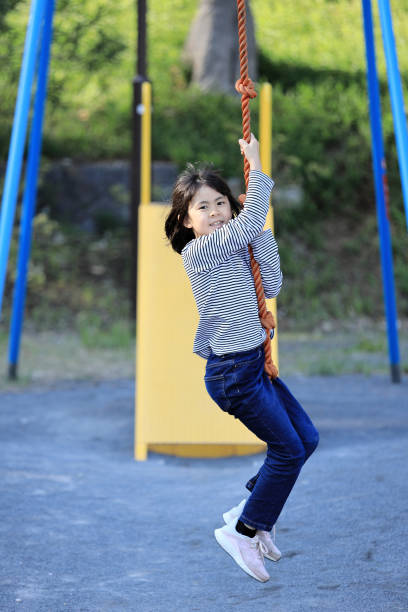 istock Japanese student girl playing with flying fox (8 years old) 1493857513