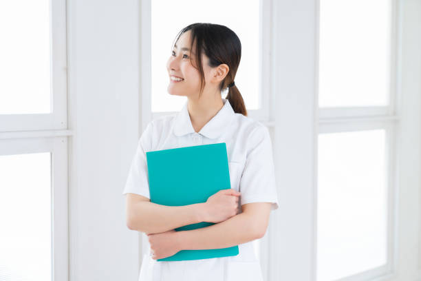 attractive asian nurse , smile stock photo