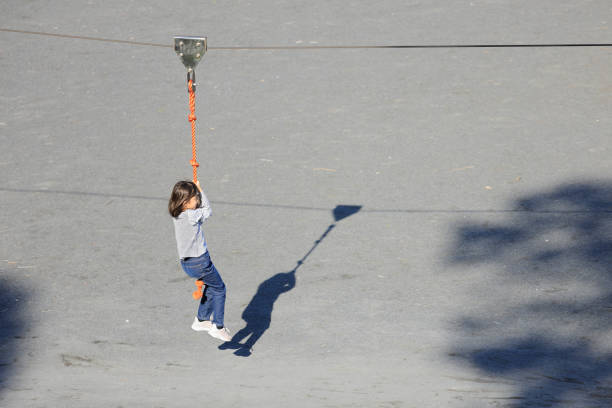 Japanese student girl playing with flying fox (8 years old)