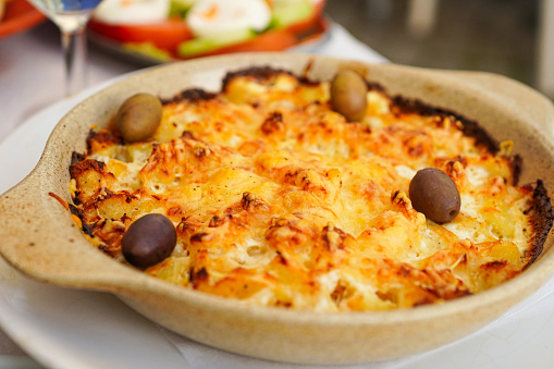 One of the most famous Portuguese dishes made with salted cod served in a mixture of cream, potatoes, and onion