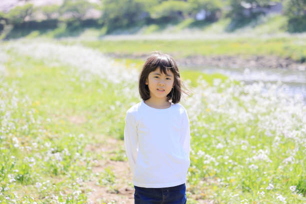 Little girl in bark background