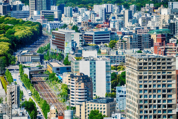 Railroad Tracks and Buildings in Shibuya City Tokyo Japan stock photo