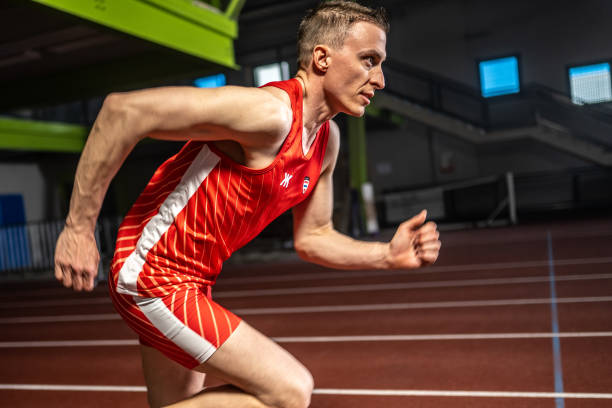 istock Athlete  running fast at stadium track 1493865062