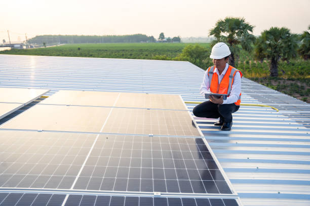 istock The solar rooftop(solar panel) with engineers check the operation of the system, Alternative energy to conserve the world's energy, Photovoltaic module idea for clean energy production 1493867503