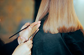 Hairdresser Hands Holding Scissors and Comb Cutting Hair Straight