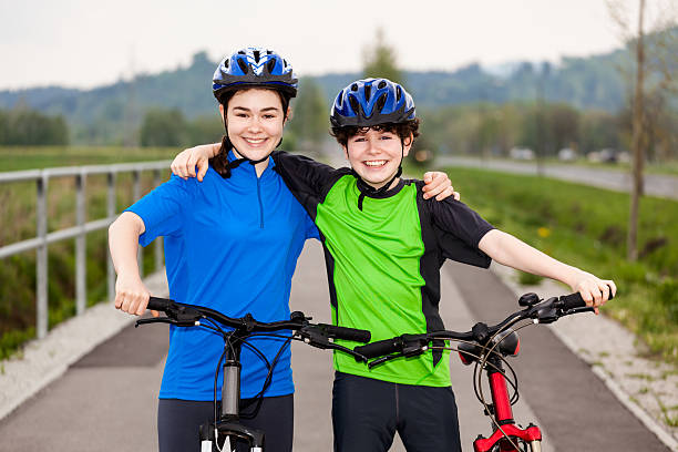 Girl and boy riding bikes 