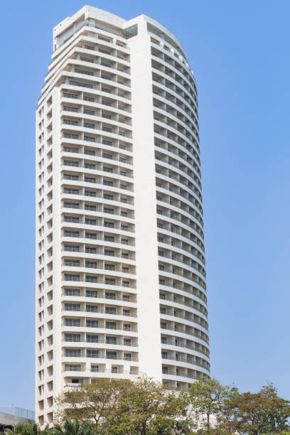 istock White high-rise building against blue sky, skyscraper. Minimal geometric architecture background. 1493882801