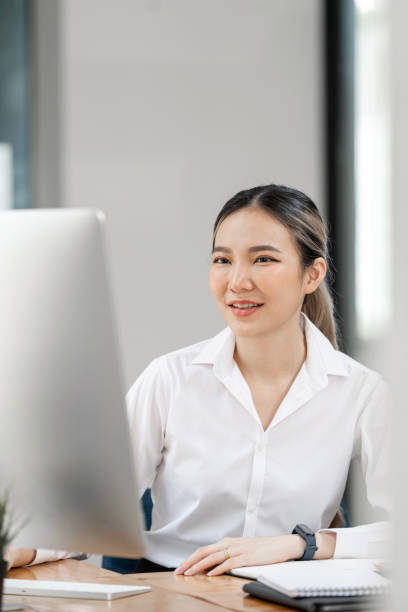 istock Young caucasian businesswoman working on a desktop computer at office. 1493894586