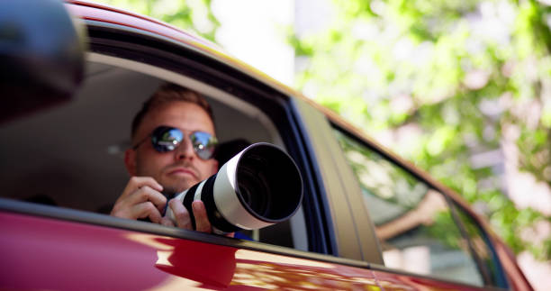 istock Private Spy In Car Taking Photos 1493900388