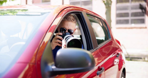 istock Private Spy In Car Taking Photos 1493900396