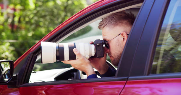 istock Private Spy In Car Taking Photos 1493900401