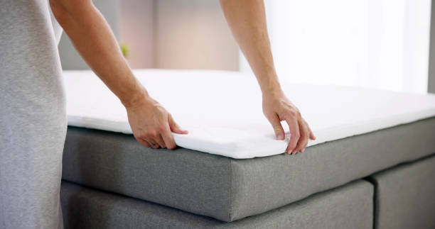 istock Mattress Topper Being Laid On Top 1493900491