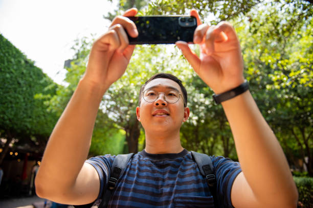 istock Korean man taking pictures 1493903314